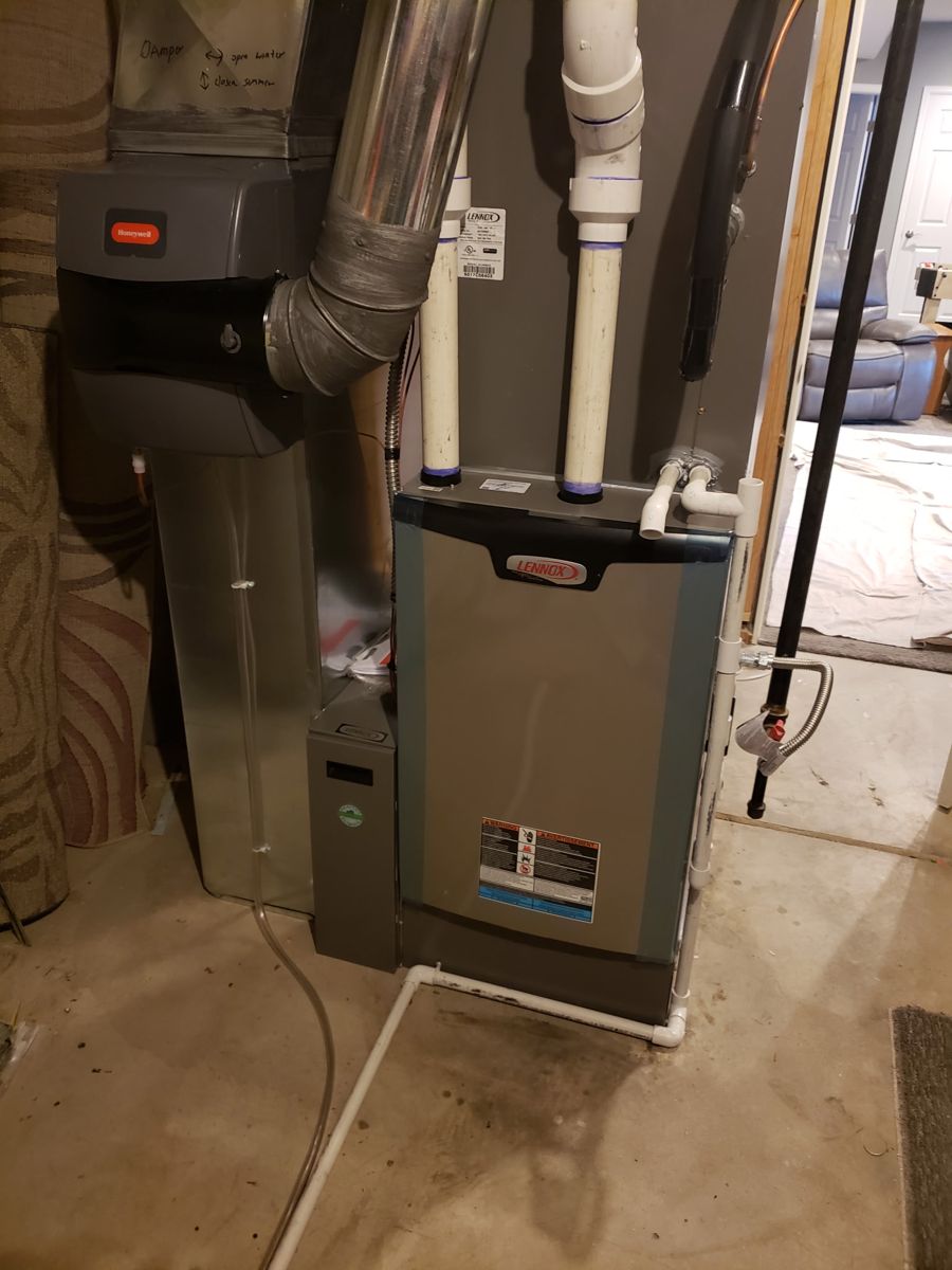 High-efficiency Lennox furnace installation with PVC venting